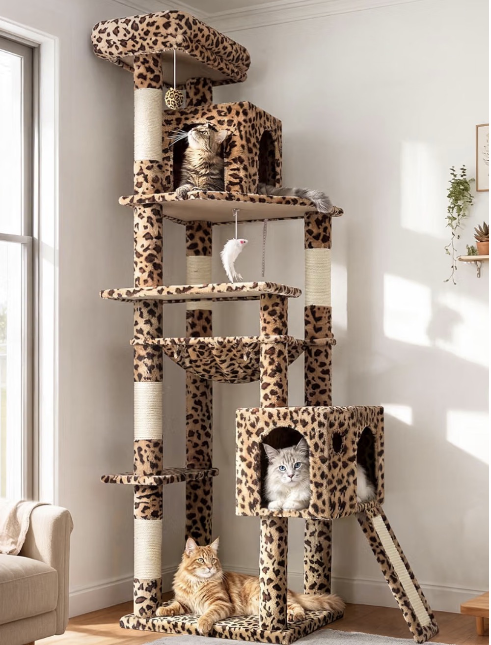 Leopard-print cat tree with multiple perches, hideaways, scratching posts, hanging toys, and a ladder